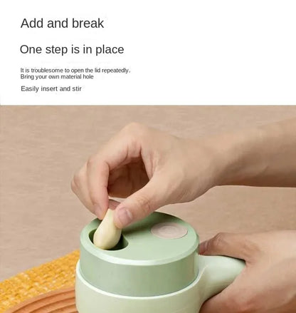 Hand placing garlic clove into specialized green kitchen gadget with side handle for easy stirring