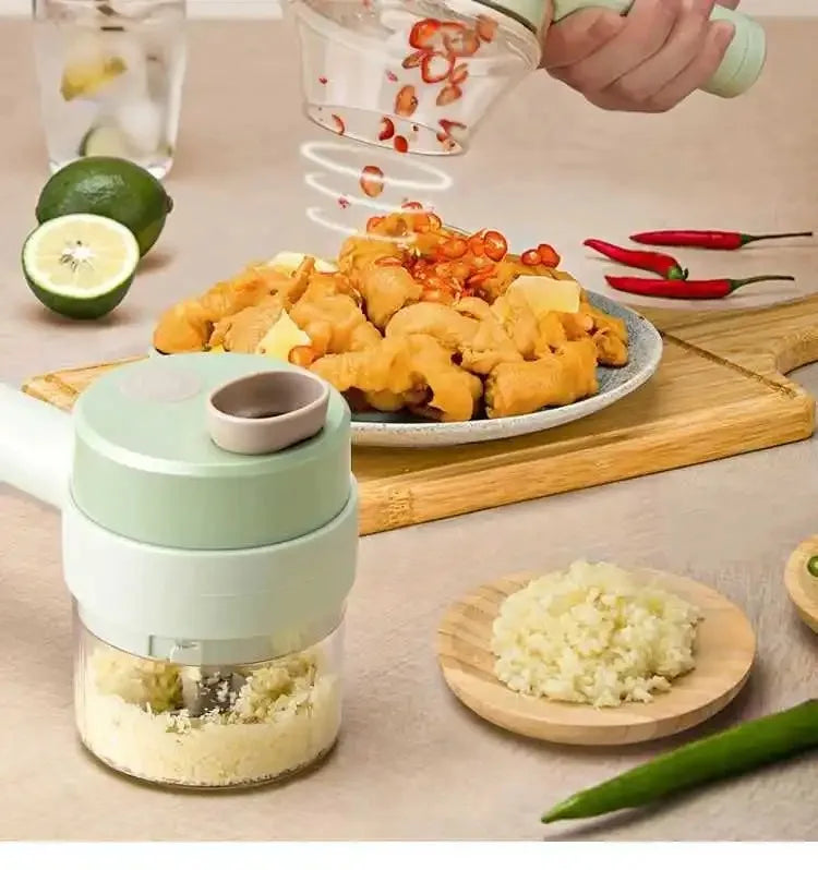 Hand sprinkling sliced red chili peppers on fried chicken pieces on a plate with an electric garlic chopper and chopped garlic in the foreground