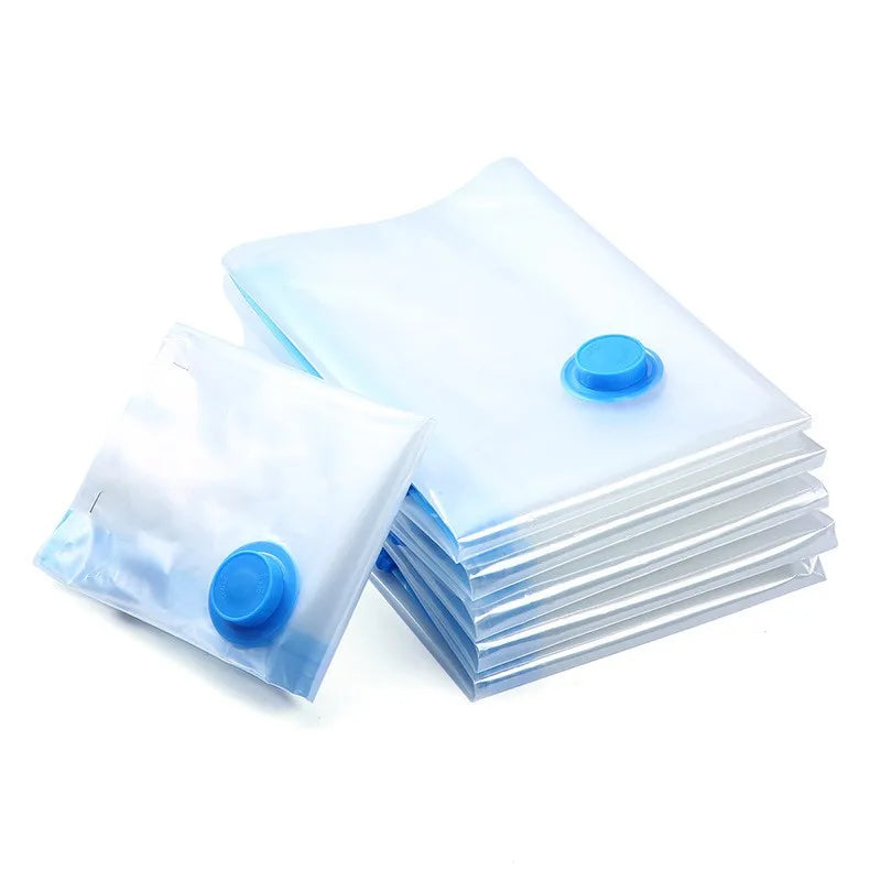 Set of clear vacuum storage bags with blue valves for space-saving clothes compression