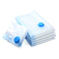 Set of clear vacuum storage bags with blue valves for space-saving clothes compression