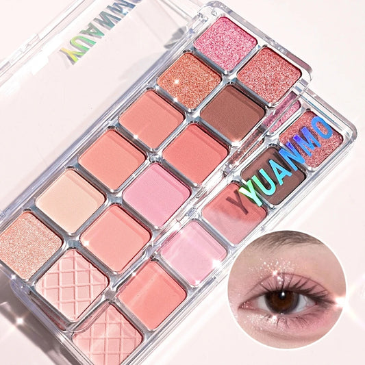 Paleta de sombras de ojos de 12 colores con brillo perlado: Stage Show Illuminator, marrón, coral, rosa y morado.