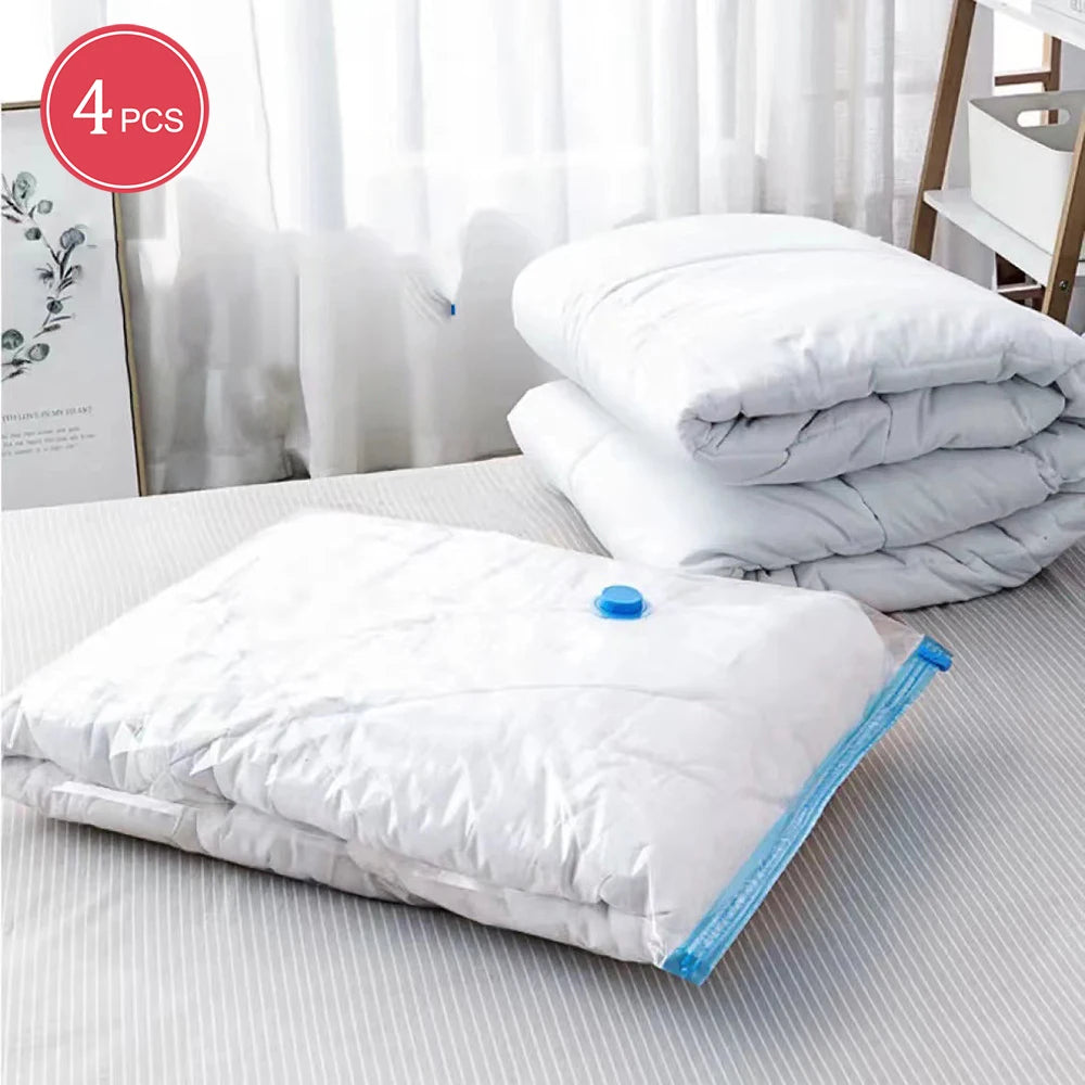 4-piece set of white comforters with one vacuum-sealed in a blue valve storage bag on striped bed