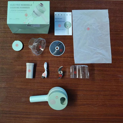 Electric handheld cooking hammer food chopper kit with main device, blades, USB cable, cup, and manual on wooden table