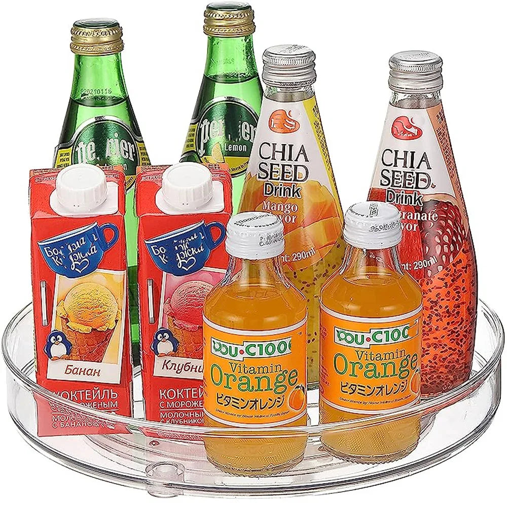 Assorted fruit drinks including Perrier lemon, chia seed drinks, orange vitamin drink, and Russian fruit milk cocktails on a clear tray
